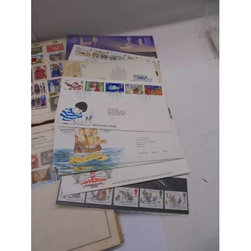 1127 - Two albums of world stamps and a quantity of first day covers.