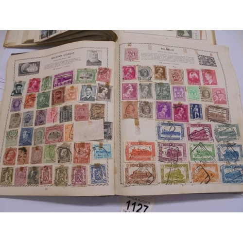 1127 - Two albums of world stamps and a quantity of first day covers.