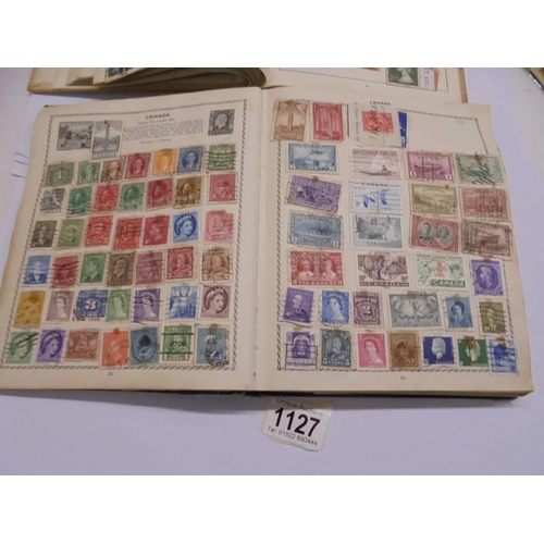 1127 - Two albums of world stamps and a quantity of first day covers.