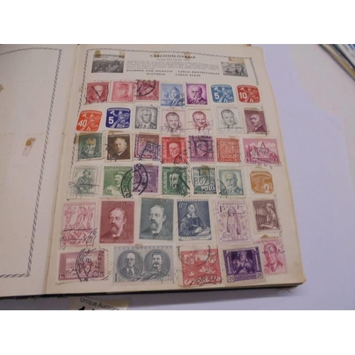 1127 - Two albums of world stamps and a quantity of first day covers.