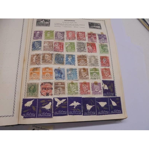 1127 - Two albums of world stamps and a quantity of first day covers.