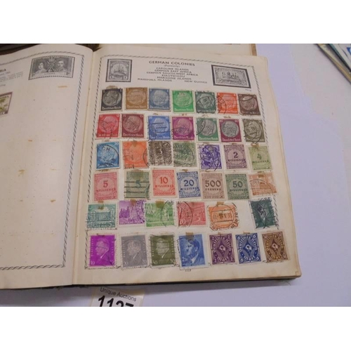 1127 - Two albums of world stamps and a quantity of first day covers.