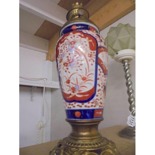 1132 - A 19th century Chinese Imari vase oil lamp base with brass fittings.