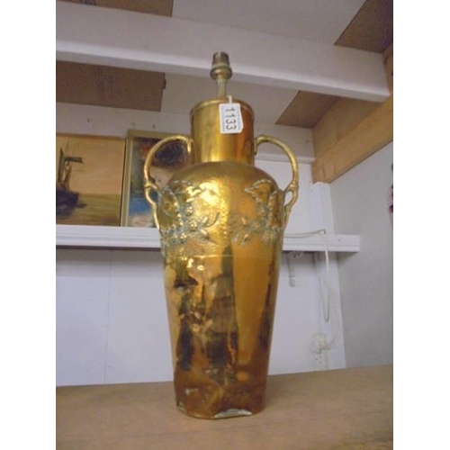 1133 - An embossed brass table lamp base (needs wiring), 47 cm to top of fitting.