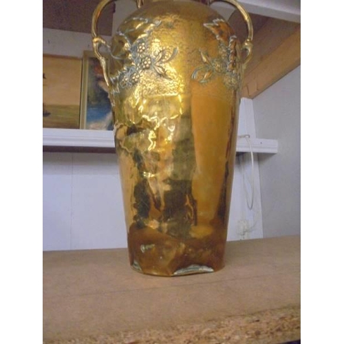 1133 - An embossed brass table lamp base (needs wiring), 47 cm to top of fitting.