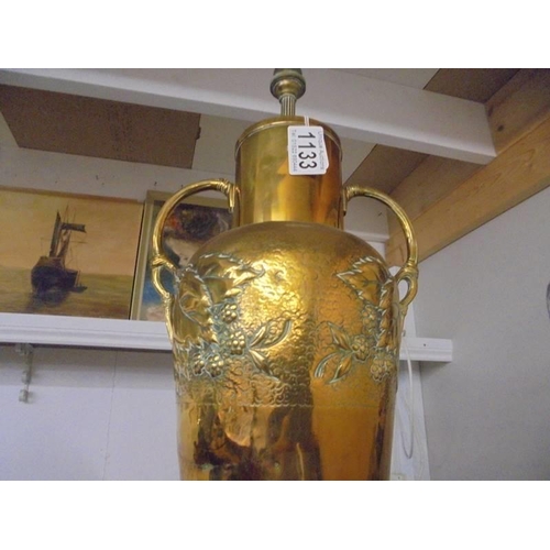 1133 - An embossed brass table lamp base (needs wiring), 47 cm to top of fitting.