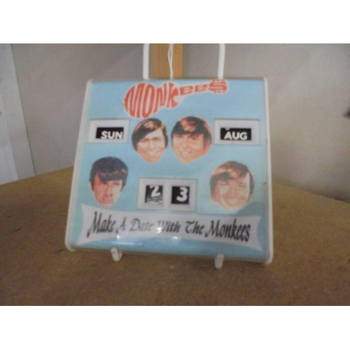 1135 - A 1960's 'The Monkees' desk perpetual calendar.