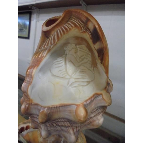 1151 - A carved cameo shell lamp featuring a mermaid.