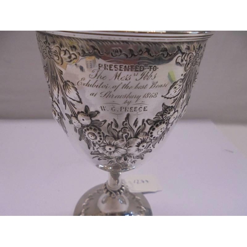 1158 - An embossed silver goblet, hallmarked Birmingham 1868/69, maker S W, 16 cm tall, 5.3 ounces.