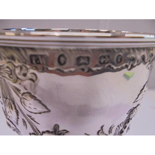 1158 - An embossed silver goblet, hallmarked Birmingham 1868/69, maker S W, 16 cm tall, 5.3 ounces.