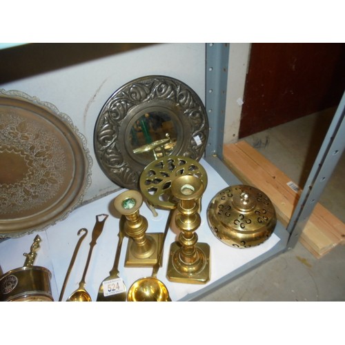 524 - A mixed lot of brass ware including candlesticks, trivet, wine coaster etc.,