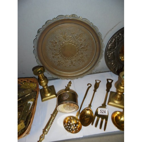 524 - A mixed lot of brass ware including candlesticks, trivet, wine coaster etc.,