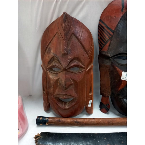 105 - Wooden tribal masks, axe etc