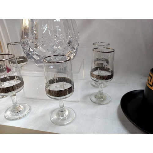 109 - A glass decanter and 6 sherry glasses