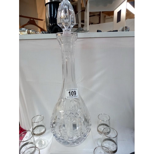 109 - A glass decanter and 6 sherry glasses