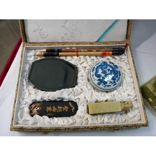 111 - A calligraphy set, Chinese boxes and other collectable items