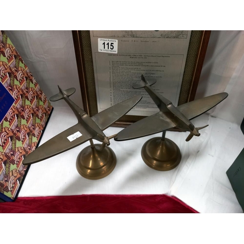 115 - 2 brass aeroplanes and a framed metal sign 'first set of rules'