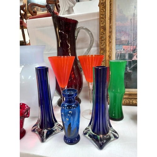 136 - A selection of coloured glass including a pair of spill vases etc