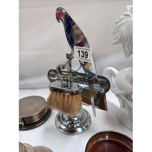 139 - An art deco chrome plated parrot mounted crumb tray on stand silver plated wine coaster and quantity... 