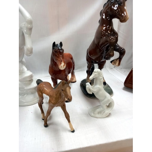 140 - A quantity of horse ornaments including Beswick rearing horse, 1 a/f