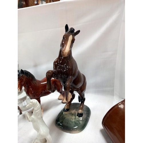 140 - A quantity of horse ornaments including Beswick rearing horse, 1 a/f