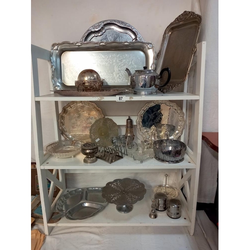 87 - A varied selection of silver plated and chrome metalware on 3 shelves