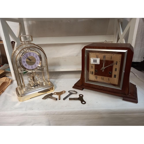 88 - A mid 20thC  clock and a modern clock