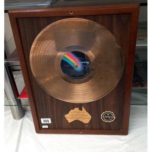 889 - A Buddy Holly gold disc in frame, presented by Astor records, sales of 75,000.00 sales A/F COLLECT O... 