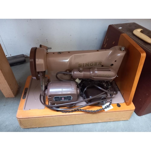 159 - A cased Singer sewing machine etc