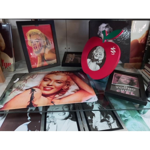 187 - A mixed lot of Marilyn Monroe photos, small calendars, magazines, DVD's etc