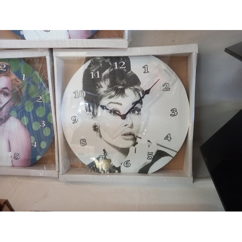 193 - 2 Marilyn Monroe clocks and 1 Audrey Hepburn (all sealed)