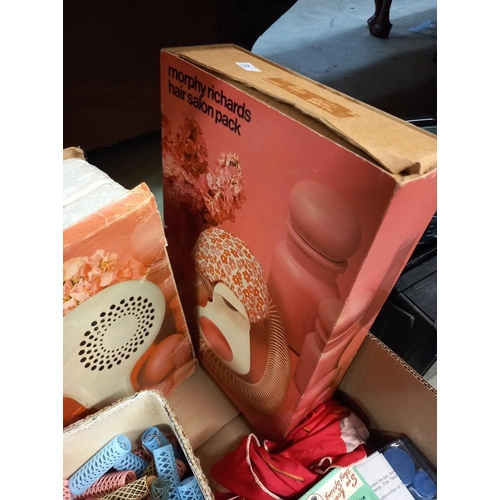 203 - A box of vintage hair care items including rollers, hair dryer etc COLLECT ONLY