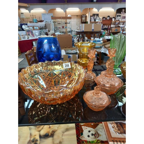 208 - A selection of coloured glass including art deco pink trinket set, celery vase, carnival glass bowl ... 