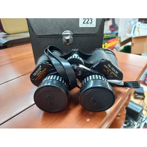 223 - A pair of Tasco binoculars in case 7 x -15 x 35