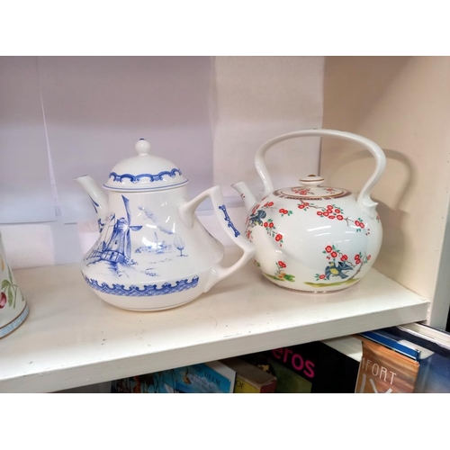 228 - A collection of 6 teapots celebrating the artistry of the earliest teapots, fine bone china for Comp... 