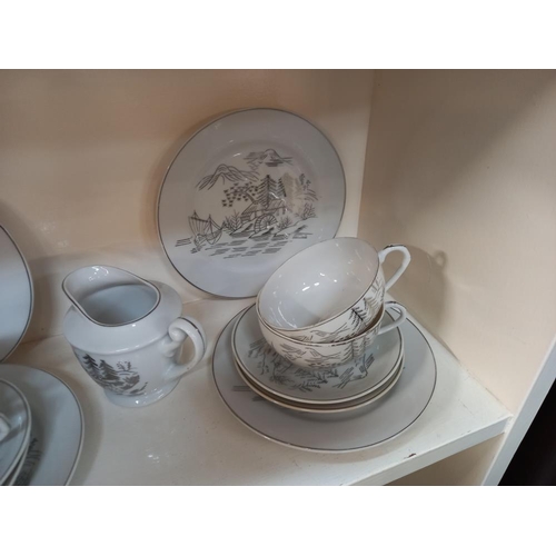 230 - An Oriental china tea set plus two trios and a teapot