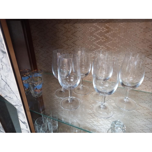 244 - A glass decanter & a good lot of assorted drinking glasses in 8's, 6's & 4's. COLLECT ONLY