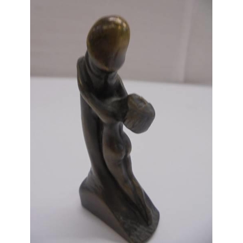 1168 - A small bronze art deco style lady holding Phallic symbol with loose bronze head of the devil.