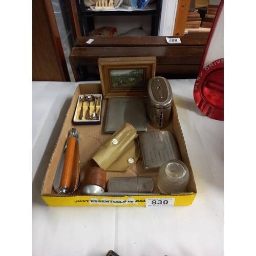 830 - A mixed lot including lighter, moneybox etc