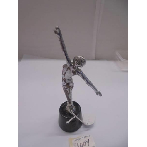 1100Y - An art deco chrome plated brass figure on a marble base, total height 19cm, figure height 14.75 cm.