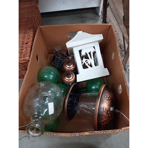 264 - A box of garden decorative items including glass wasp trap etc