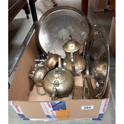 284 - A box of metalware including silver plate, brass and cutlery