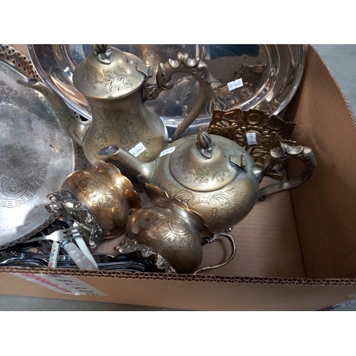 284 - A box of metalware including silver plate, brass and cutlery