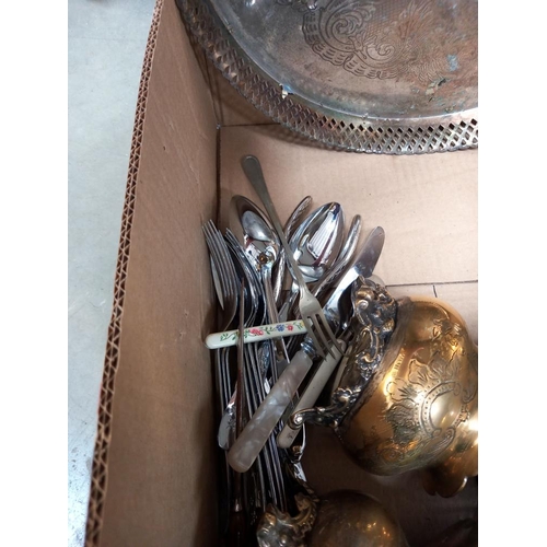 284 - A box of metalware including silver plate, brass and cutlery