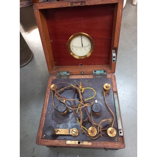 290 - A vintage oak cased L M Ericson Stockholm crystal receiver and a brass blow lamp