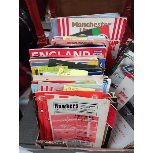 304 - A collection of football programmes