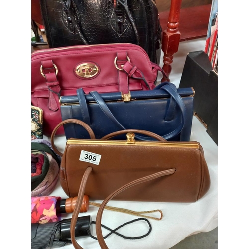 305 - A good selection of ladies modern and vintage handbags, umbrellas, scarf, purse etc