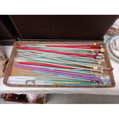 315 - A large quantity of knitting wool and knitting needles in 2 storage boxes COLLECT ONLY