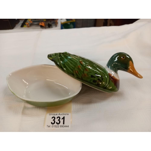 331 - A small lidded duck terrine dish by Michel Caugant