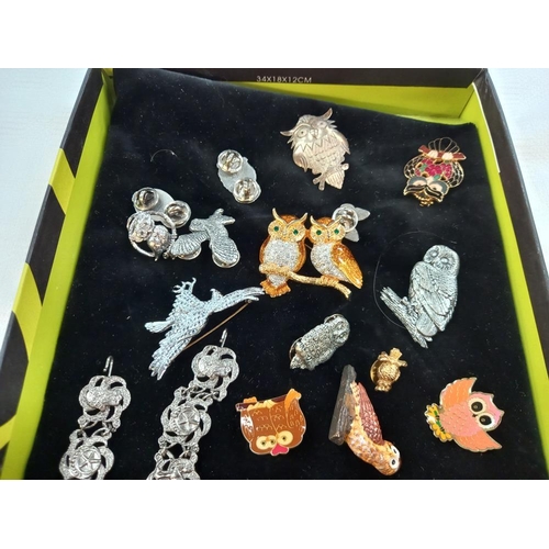 342 - A quantity of owl badges and brooches including gilded Avon owl vinaigrette brooch